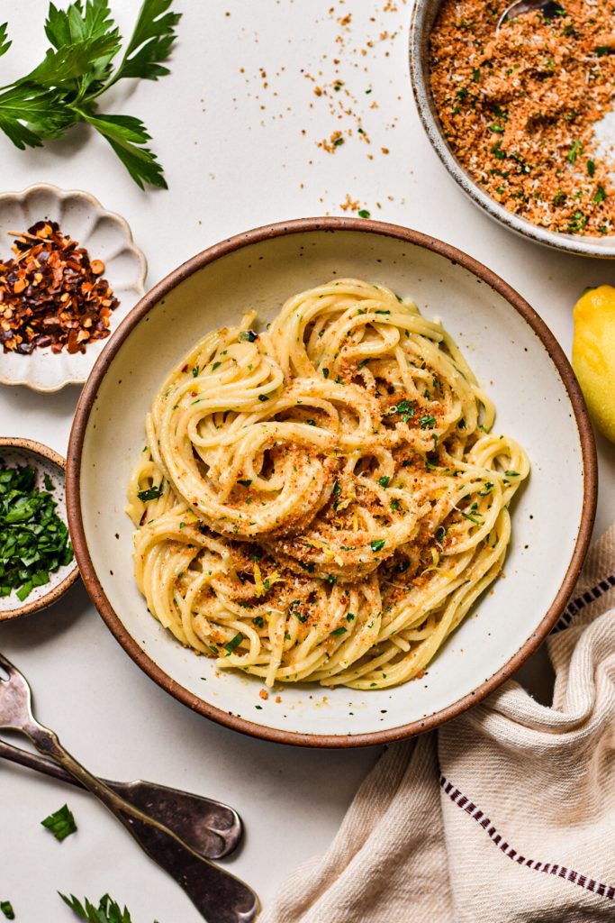 Overhead shot of pasta with garlic butter served in a pasta bowl.