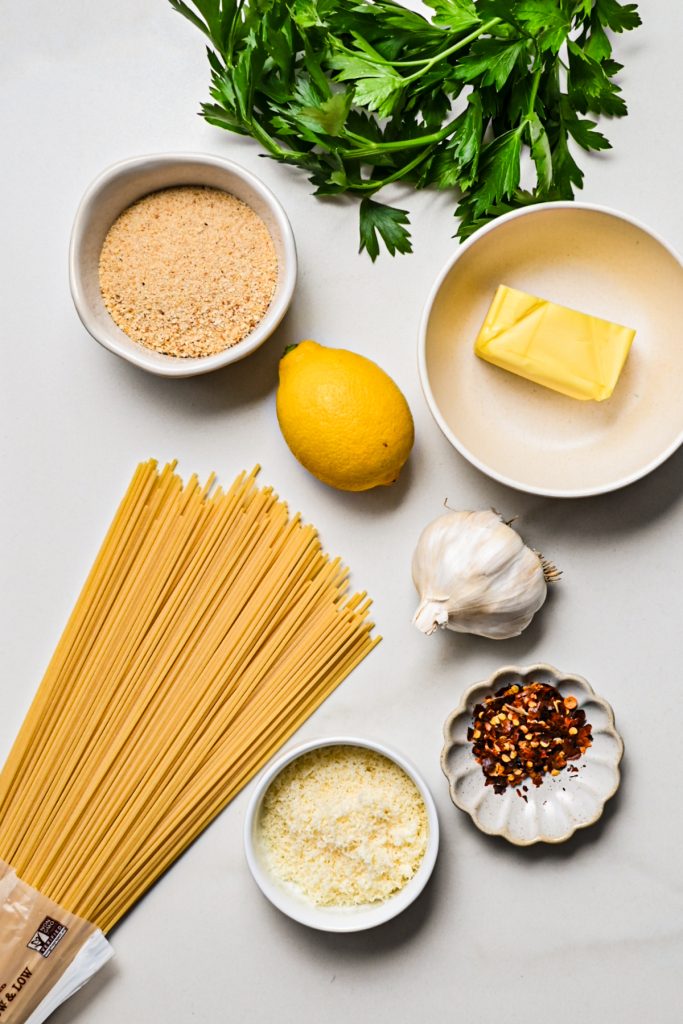 Overhead shot of ingredients needed to make pasta with garlic butter.