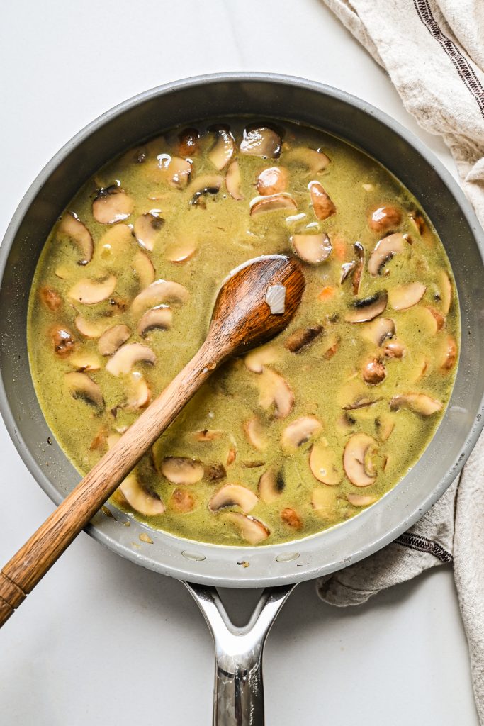 Liquid and pastina pasta added to the pot of vegetables.