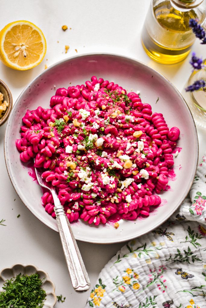 Creamy chickpea beet pasta with springy pasta in a bowl.